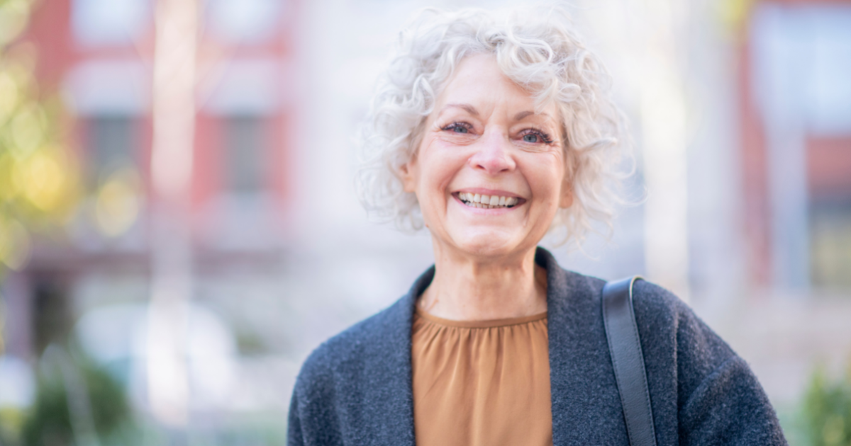 A woman dealing with senior incontinence stays happy by doing the best she can to manage it.